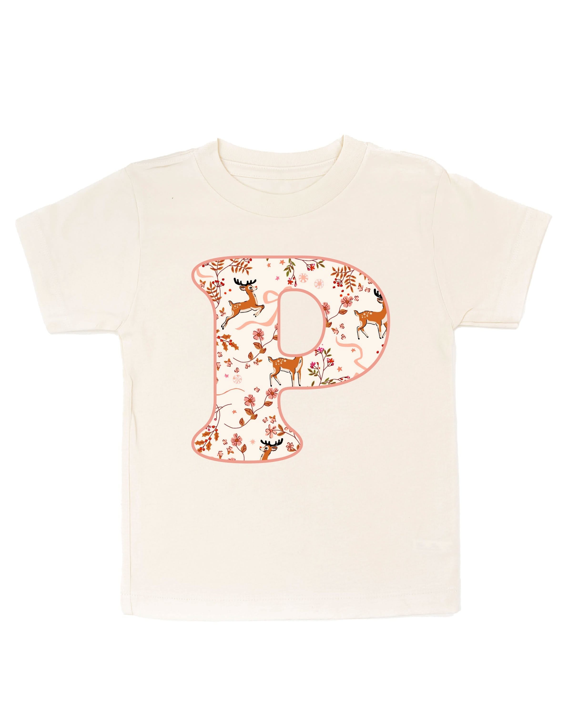 Child tee in natural with Christmas pattern reindeer with initial P on front, shown on flat lay – Little Mama Shirt Shop
