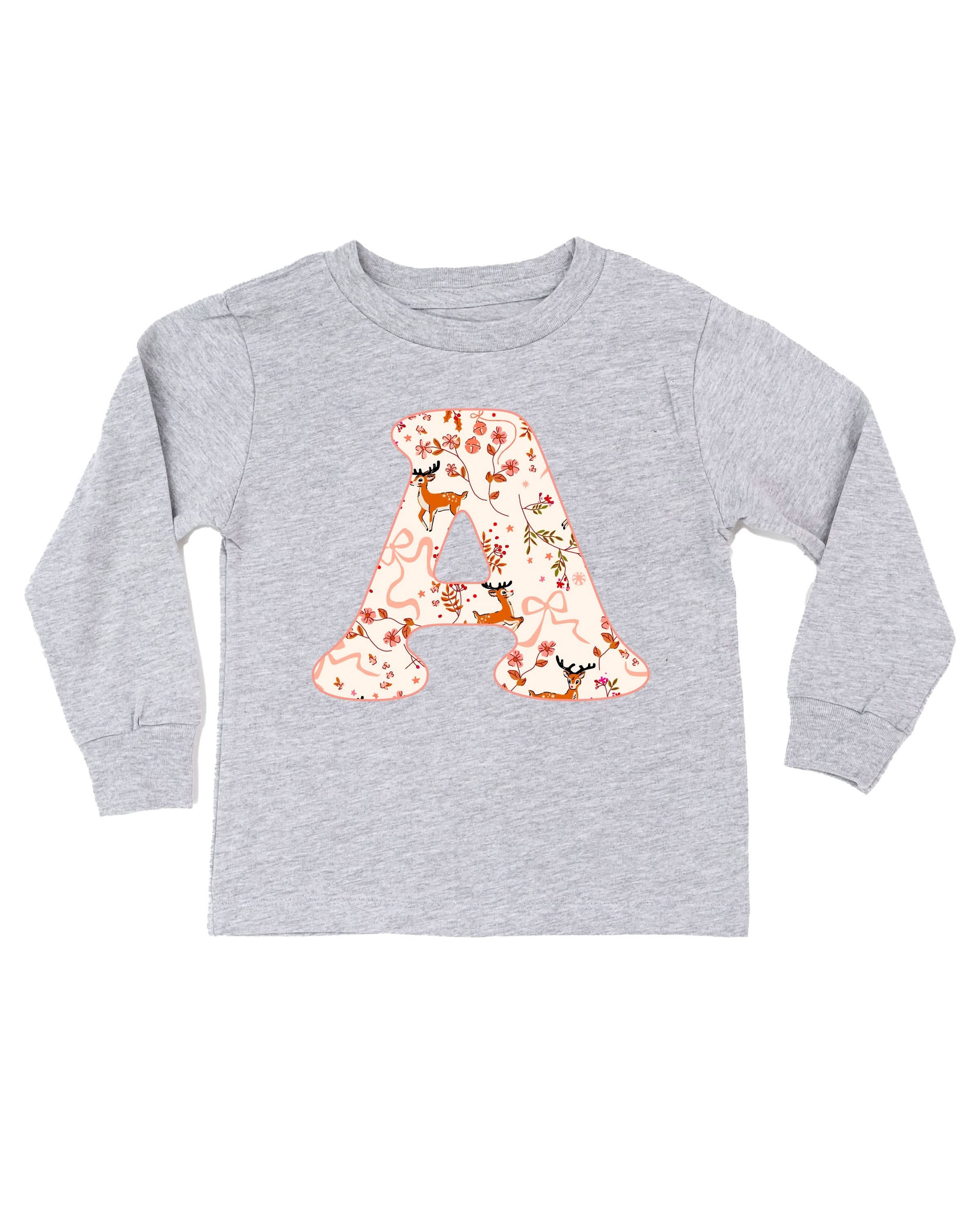 Child long sleeve in white with Christmas patterned reindeer initial A on front, shown on flat lay – Little Mama Shirt Shop
