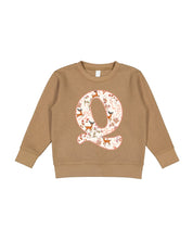Child sweater in coyote brown with Christmas patterned reindeer initial Q on front, shown on flat lay – Little Mama Shirt Shop