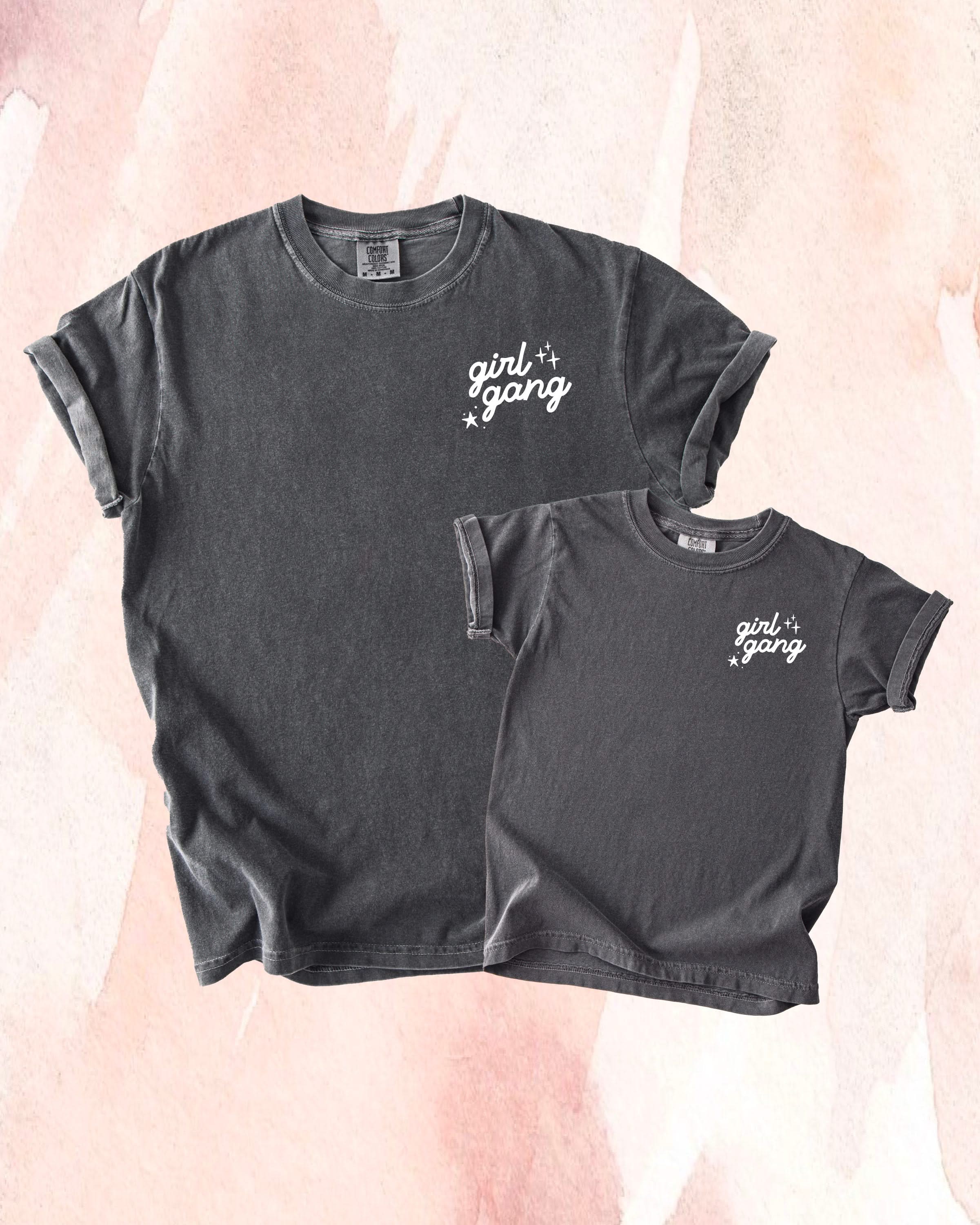 Adult and child tees in pepper with "girl gang" design on front chest, shown on flat lay - Little Mama Shirt Shop