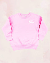 Child sweater in light pink with "girl gang" design on front chest, shown on flat lay - Little Mama Shirt Shop