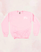 Adult sweater in light pink with "girl gang" design on front chest, shown on flat lay - Little Mama Shirt Shop