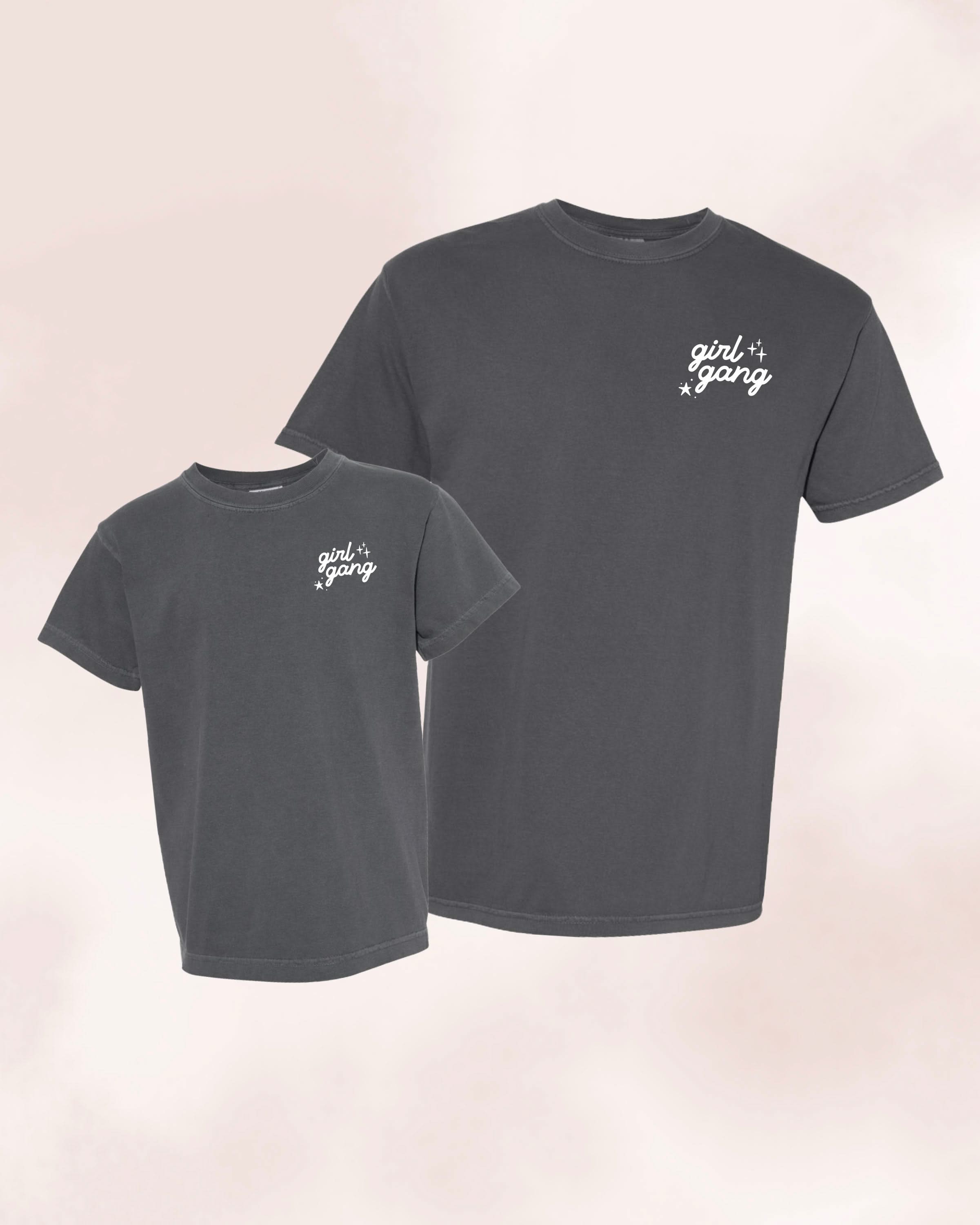 Adult and child tees in pepper with "girl gang" design on front chest, shown on flat lay - Little Mama Shirt Shop
