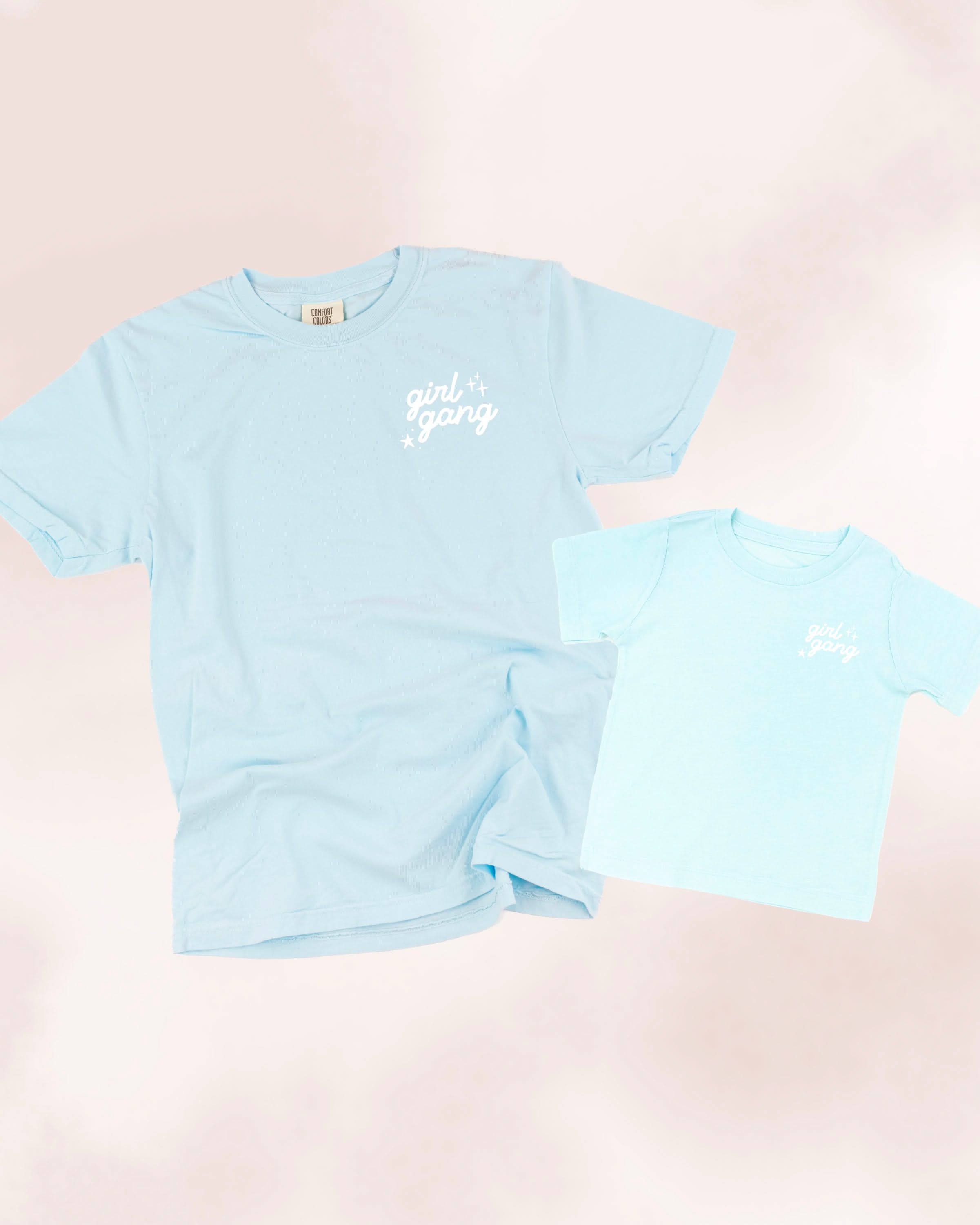 Adult and child tees in chambray and ice blue with "girl gang" design on front chest, shown on flat lay - Little Mama Shirt Shop