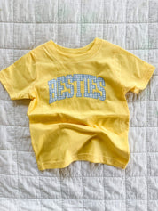 Butter yellow girls shirt with blue gingham “besties” lettering