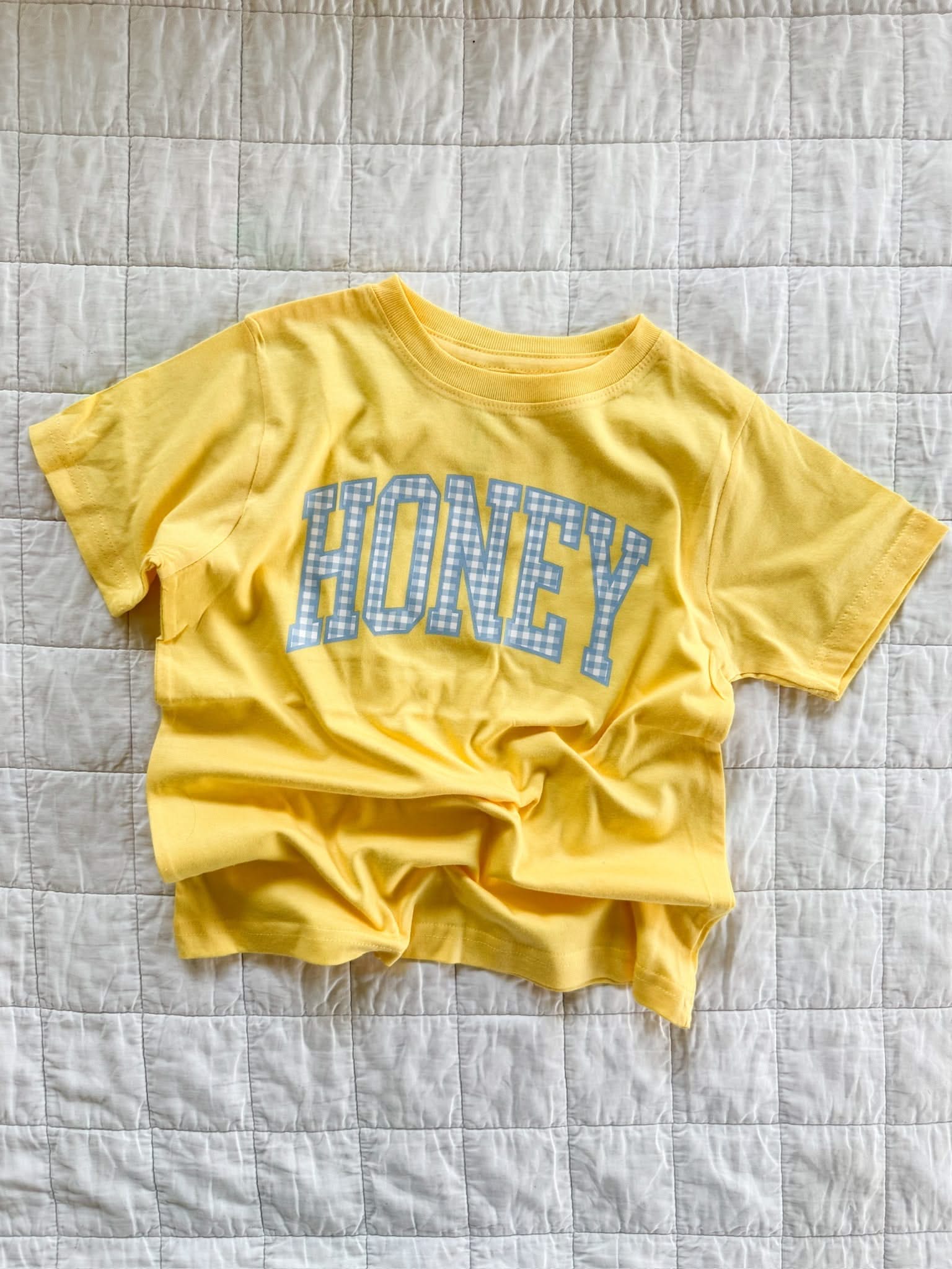 Butter yellow girls shirt with blue gingham “honey” lettering