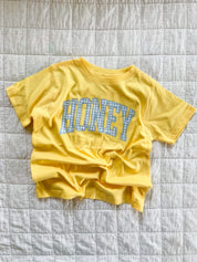 Butter yellow girls shirt with blue gingham “honey” lettering