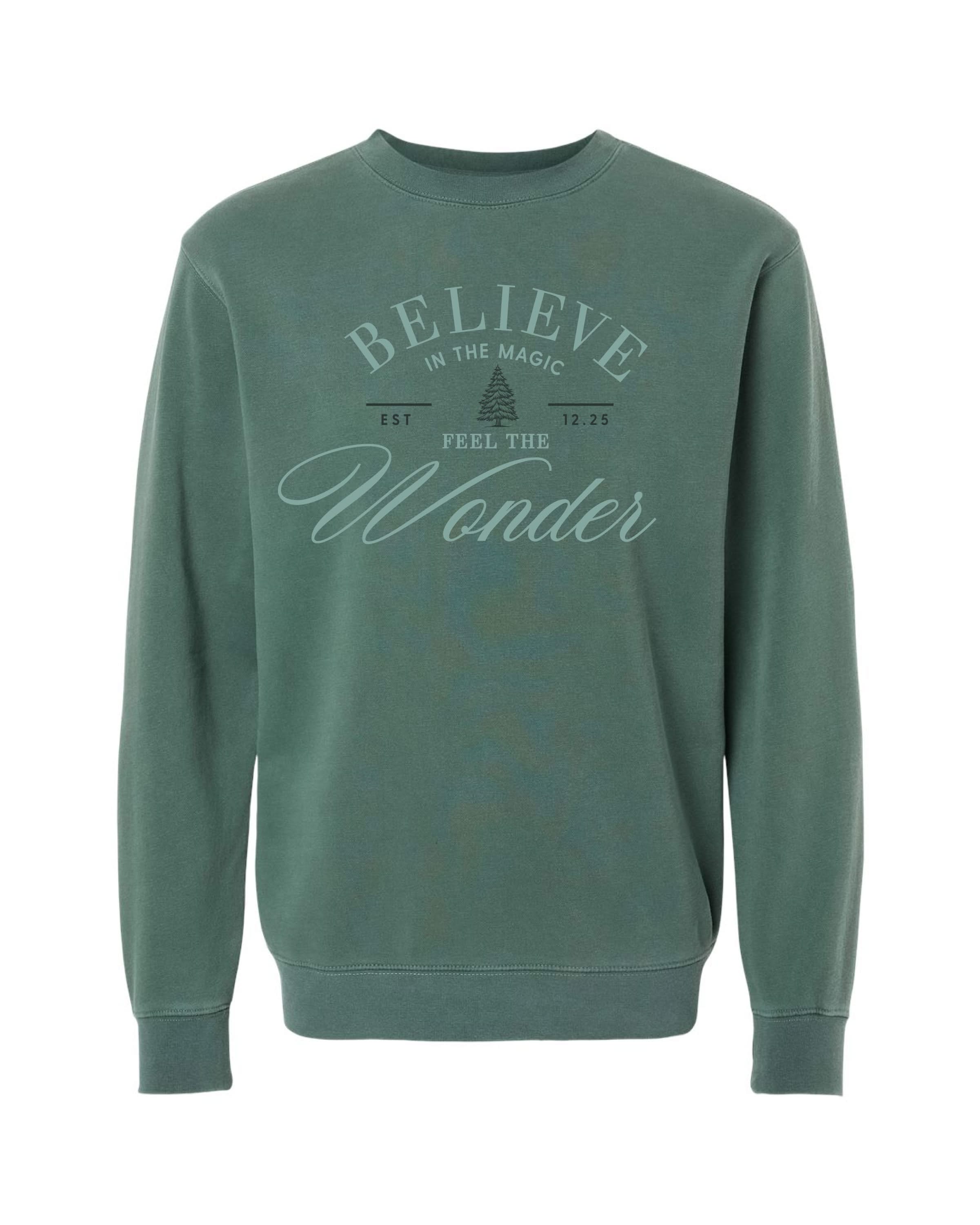 Adult sweater in alpine with 'Believe in the magic, feel the wonder' designs on front, shown on model – Little Mama Shirt Shop