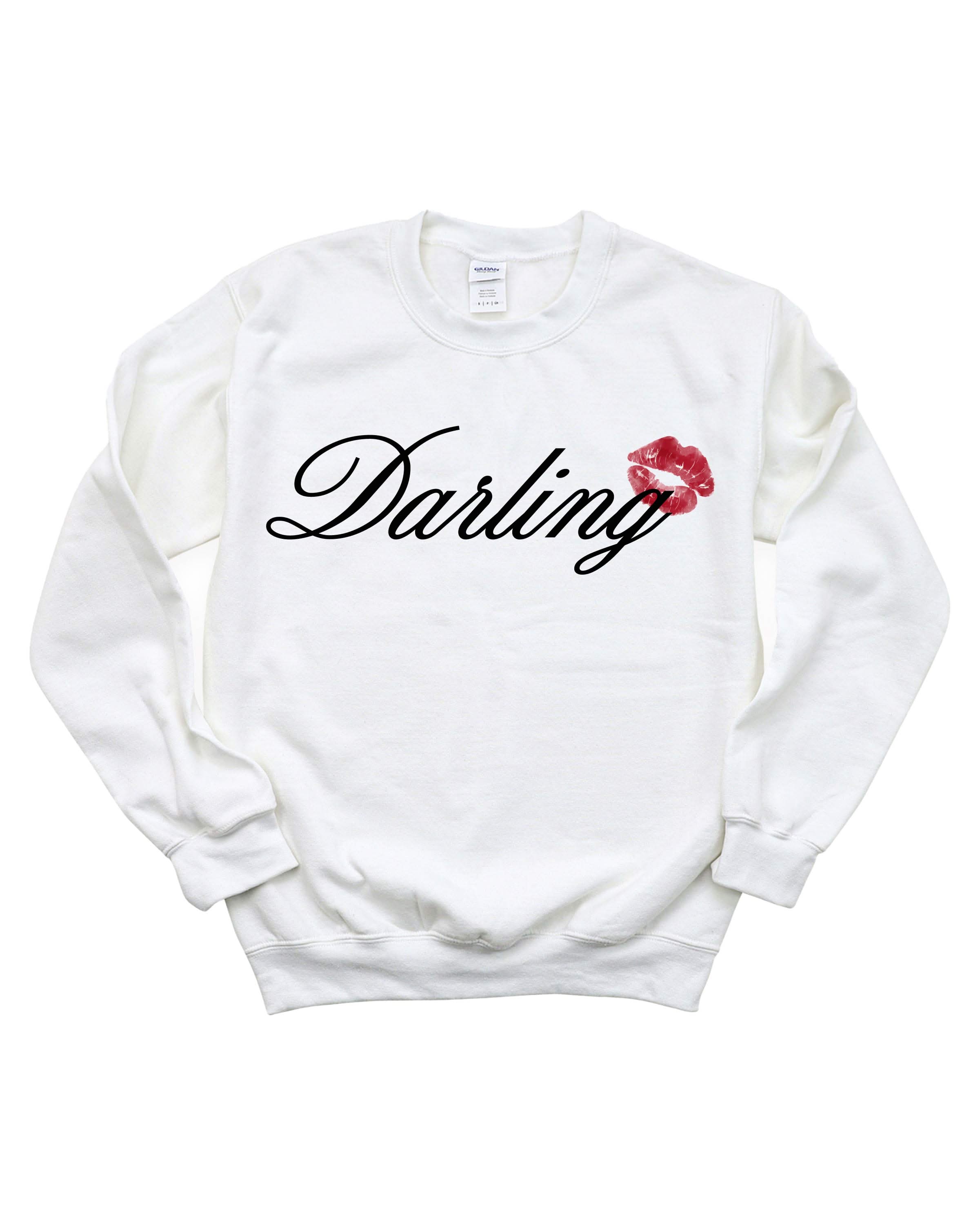 Adult white sweater with "Darling" script and lipstick kiss design, shown on flat lay  – Little Mama Shirt Shop