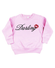 Child pink sweater with "Darling" script and lipstick kiss design, shown on flat lay  – Little Mama Shirt Shop