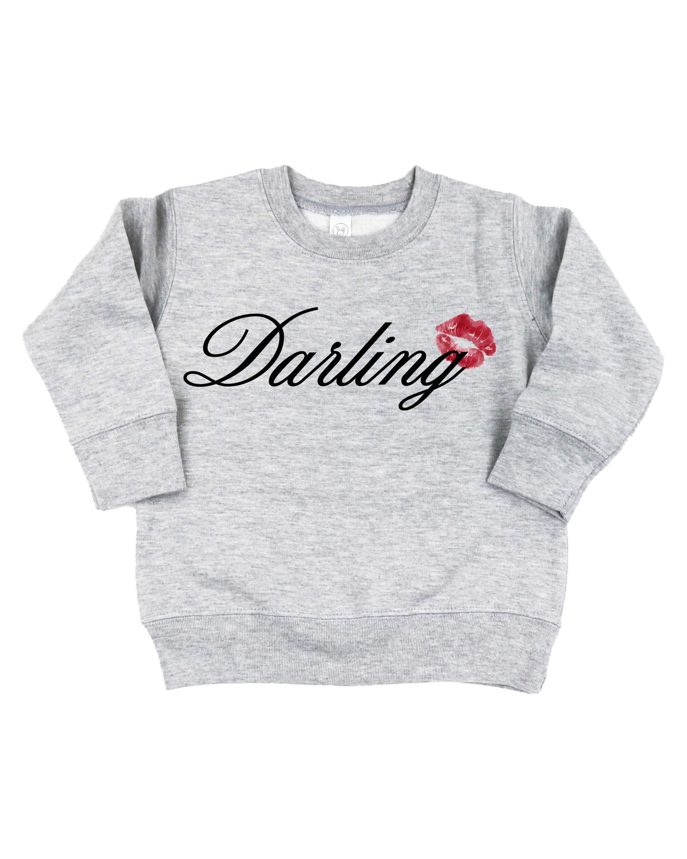 Child gray sweater with "Darling" script and lipstick kiss design, shown on flat lay  – Little Mama Shirt Shop