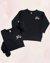 Adult and child sweaters in black with "girl gang" design on front chest, shown on flat lay - Little Mama Shirt Shop