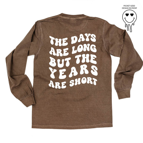 long_sleeve_comfort_colors_the_days_are_long_but_the_years_are_short_heart_eye_smiley_little_mama_shirt_shop
