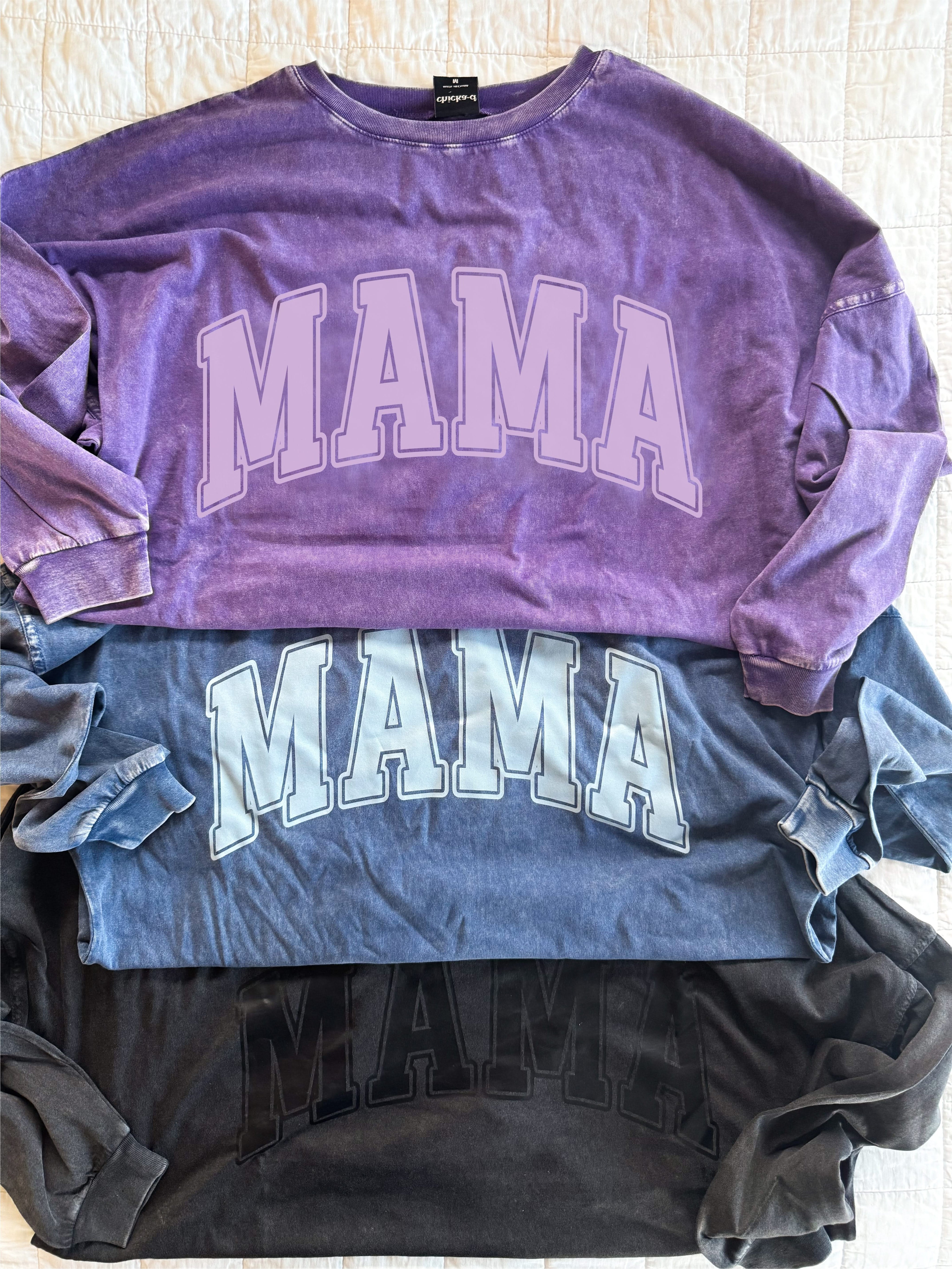 Oversized Big Tee with “MAMA” graphic in purple, washed denim, and black on flatlay - Little Mama Shirt Shop