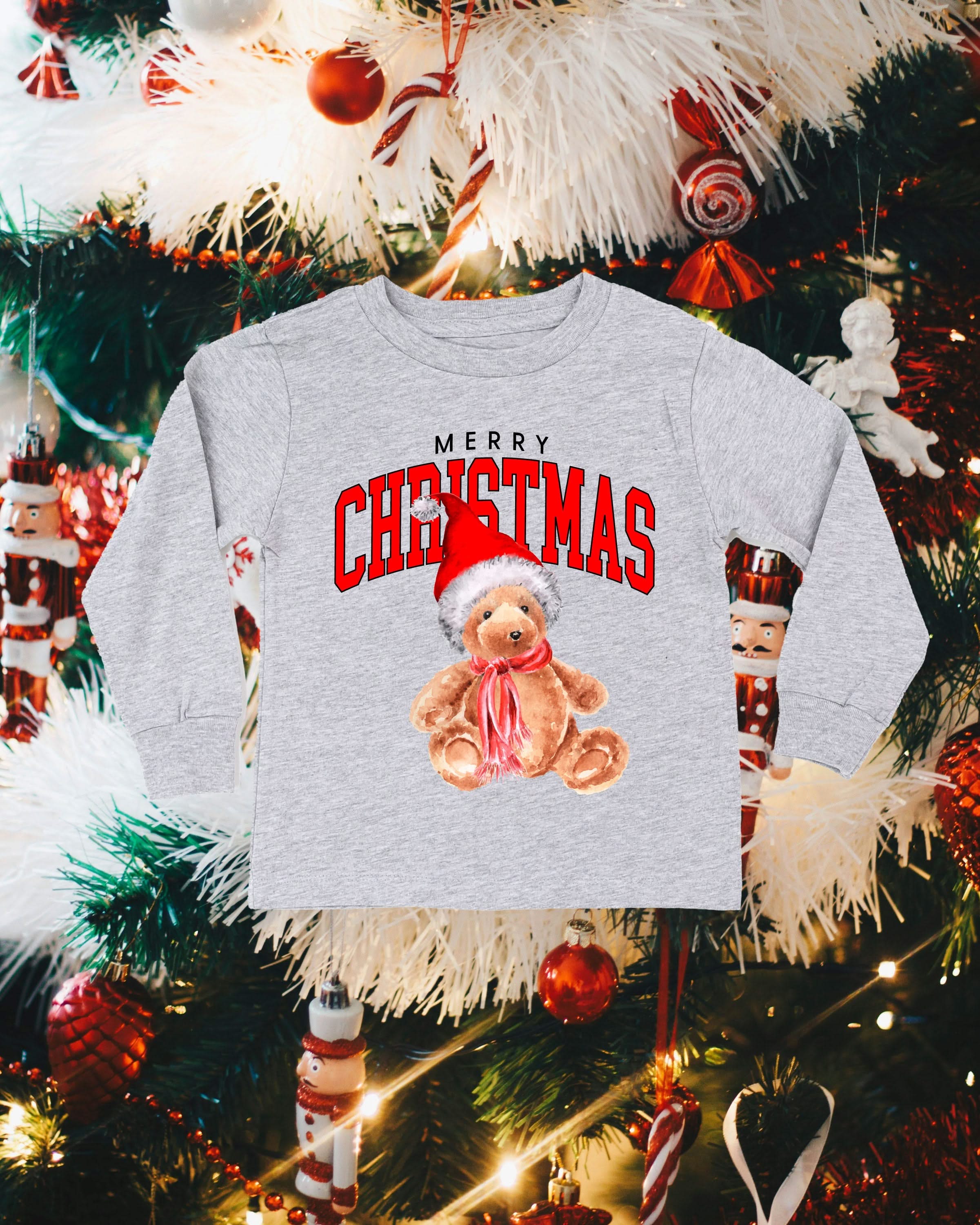 Child long sleeve in gray with merry Christmas teddy graphic, shown on flat lay – Little Mama Shirt Shop