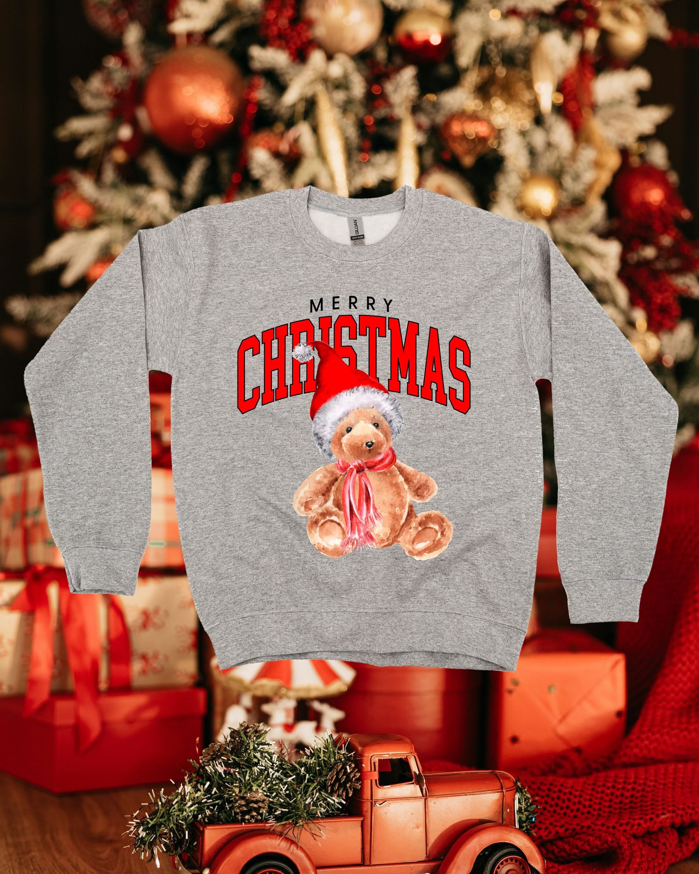 Adult gray basic fleece with merry Christmas teddy graphic, shown on flat lay – Little Mama Shirt Shop