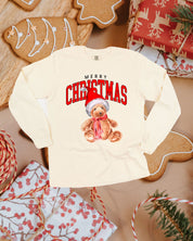 Adult long sleeve comfort colors tee in ivory with merry Christmas teddy graphic, shown on flat lay – Little Mama Shirt Shop