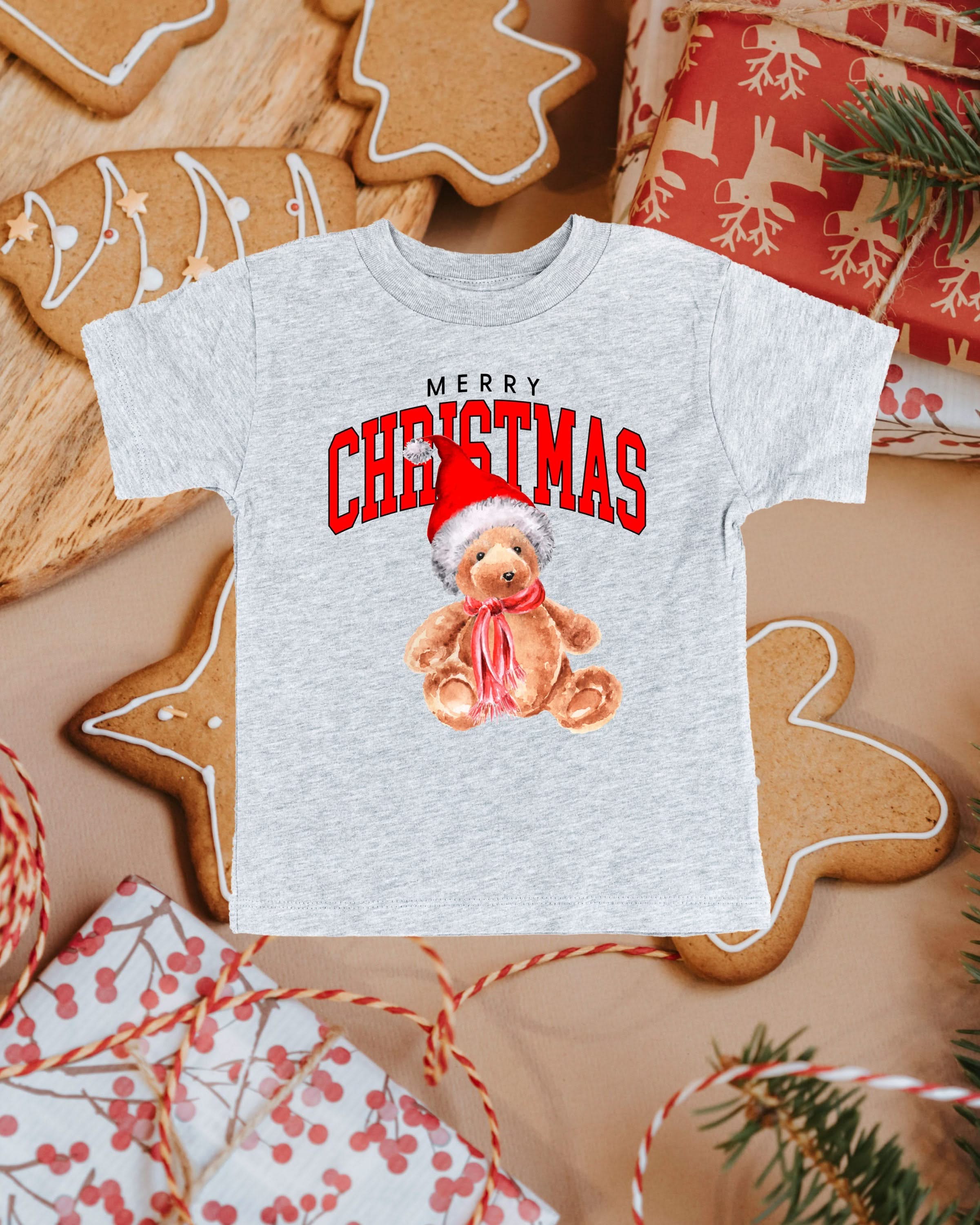 Child tee in gray with merry Christmas teddy graphic, shown on flat lay – Little Mama Shirt Shop