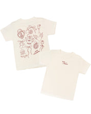 Child tee in natural with "More Amore" print on front and Valentines collage design on back, shown on flat lay – Little Mama Shirt Shop