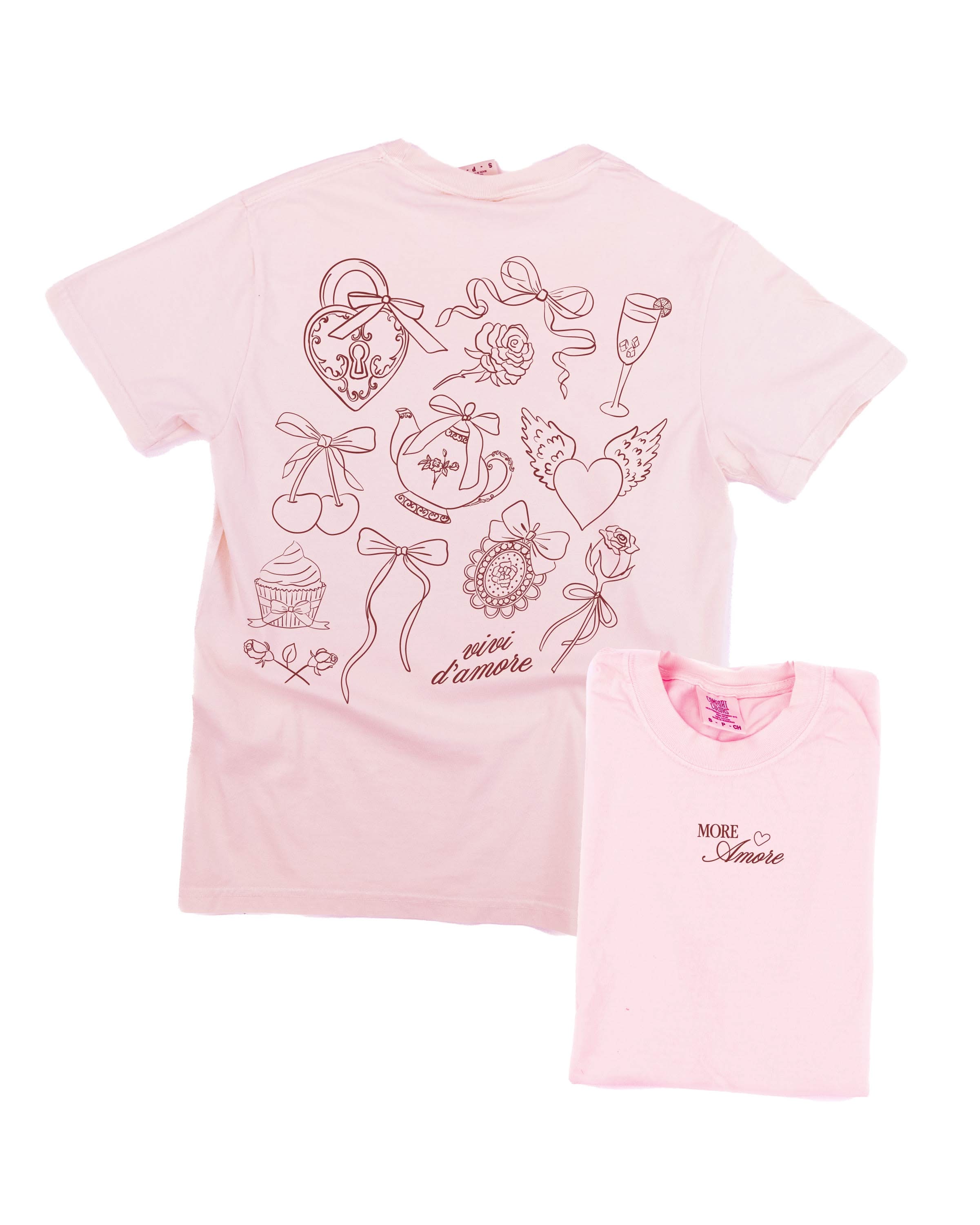 Adult tee in blossom with "More Amore" print on front and Valentines collage design on back, shown on flat lay – Little Mama Shirt Shop