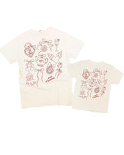 Adult and Child tee in ivory with Valentines collage design on back, shown on flat lay – Little Mama Shirt Shop