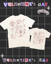 Adult and Child tee in ivory with Valentines collage design on back, shown on flat lay – Little Mama Shirt Shop