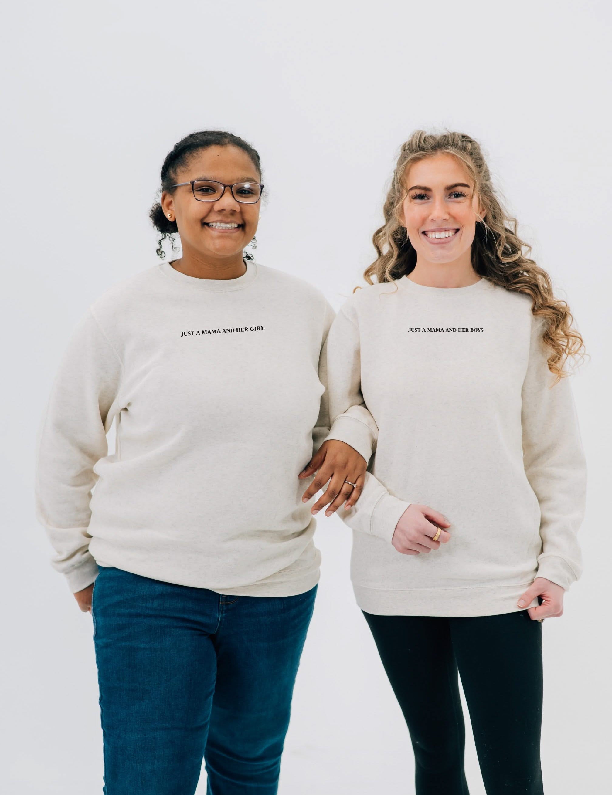 Adult sweaters in natural with "Just a Mama and Her ___" design on the front, seen on models - Little Mama Shirt Shop