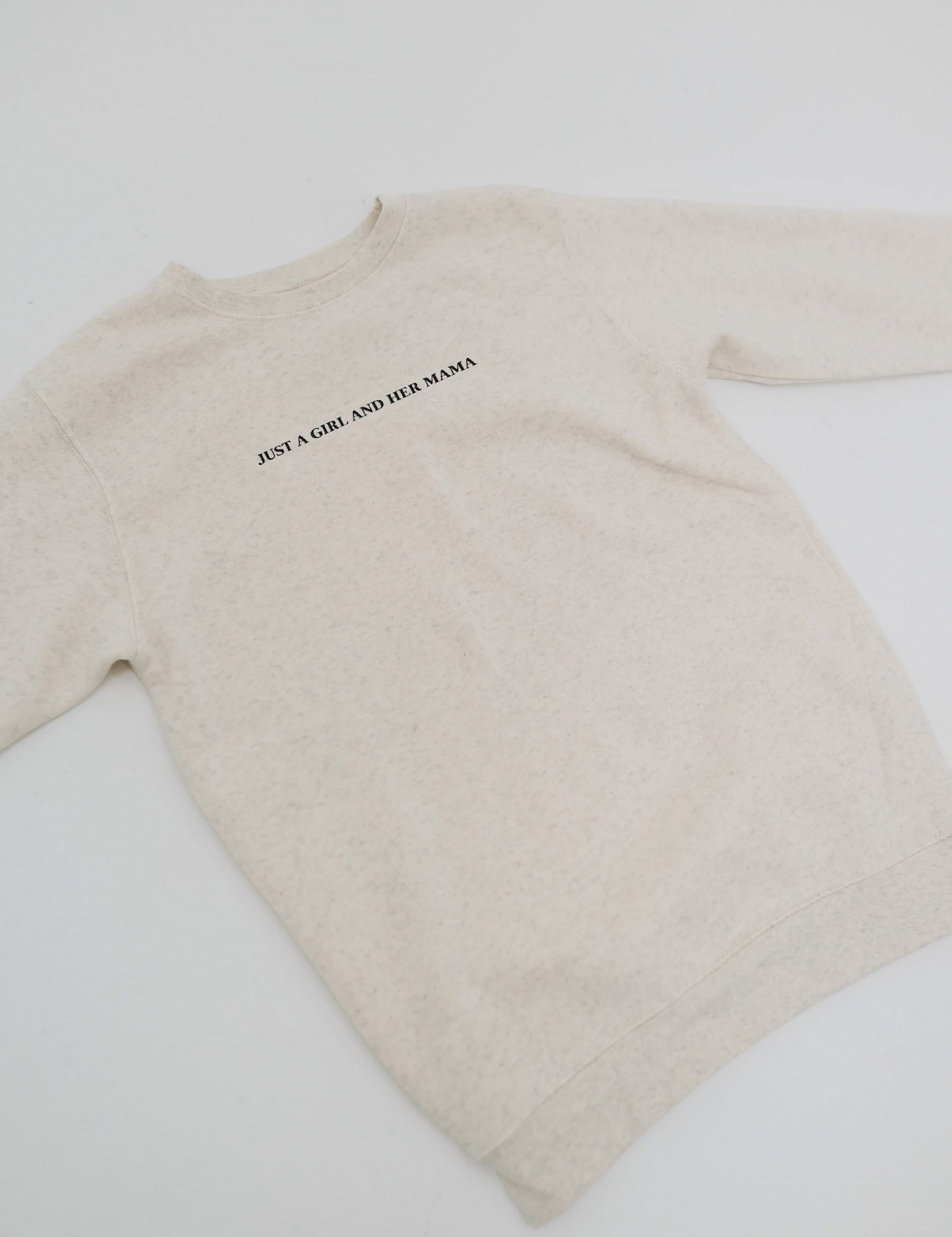 Her Mama" design on front, shown on flat lay - Little Mama Shirt Shop