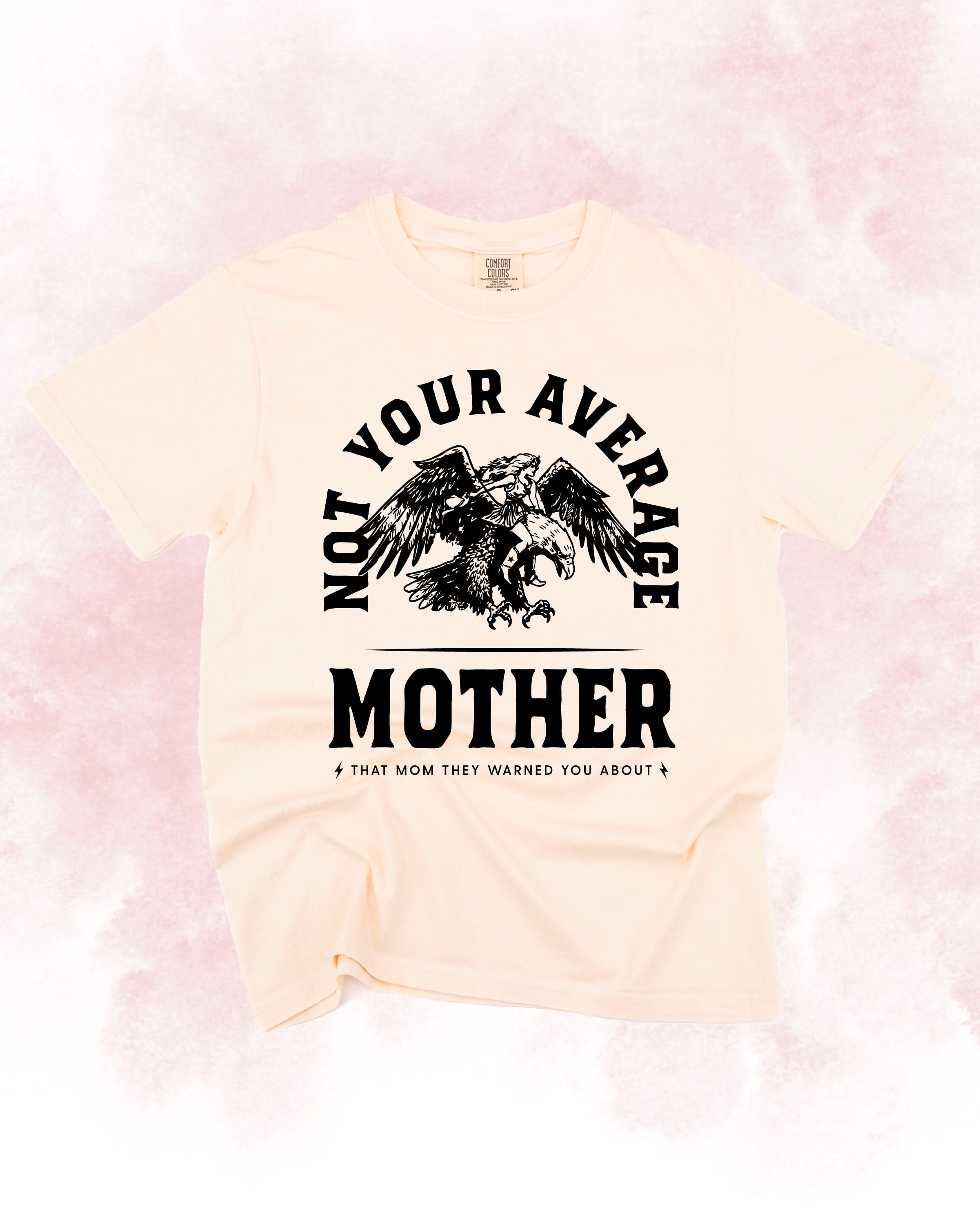 Adult tee in ivory with "Not Your Average" design on front, shown on flat lay – Little Mama Shirt Shop