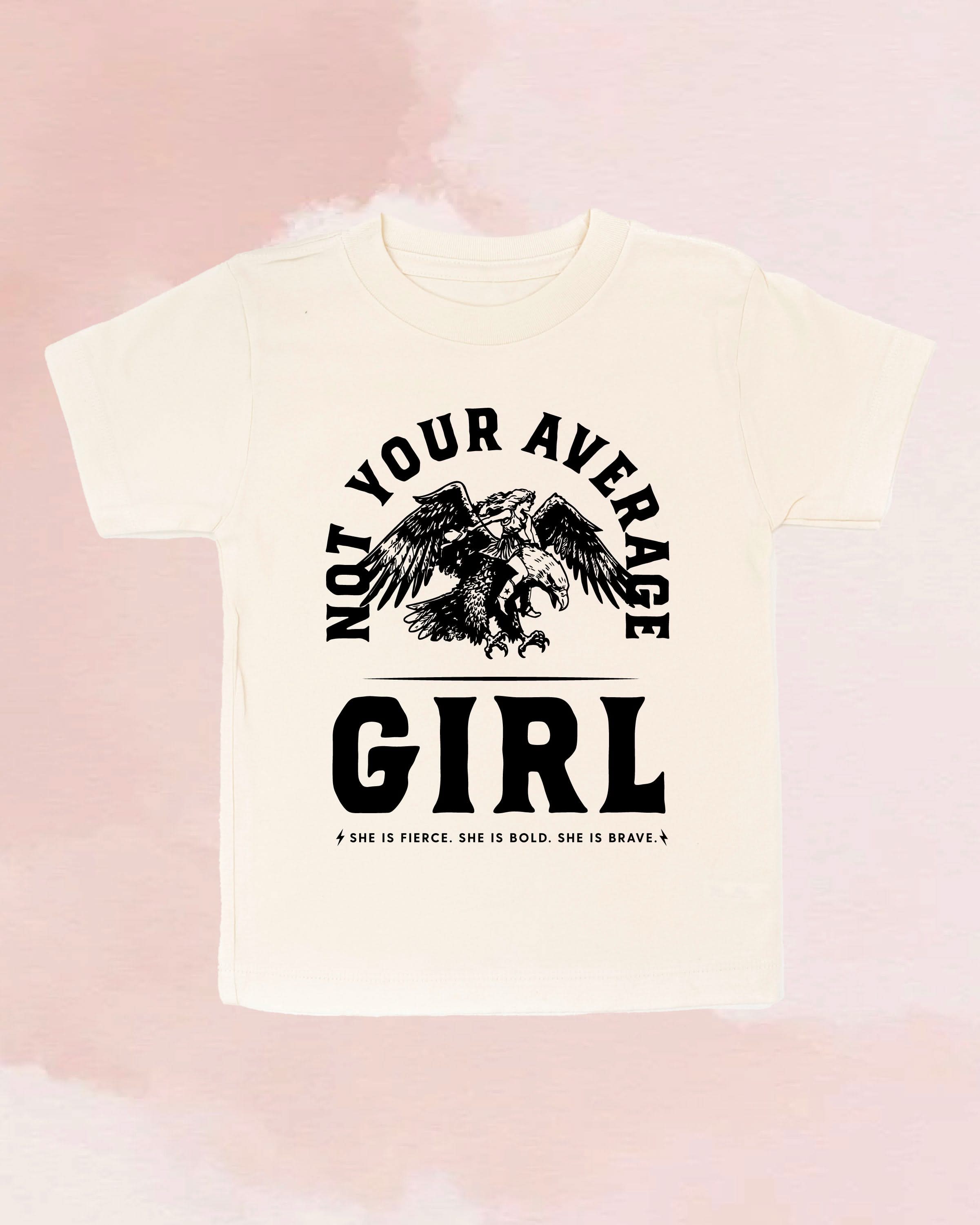 Child tee in natural with "Not Your Average" design on front, shown on flat lay  – Little Mama Shirt Shop