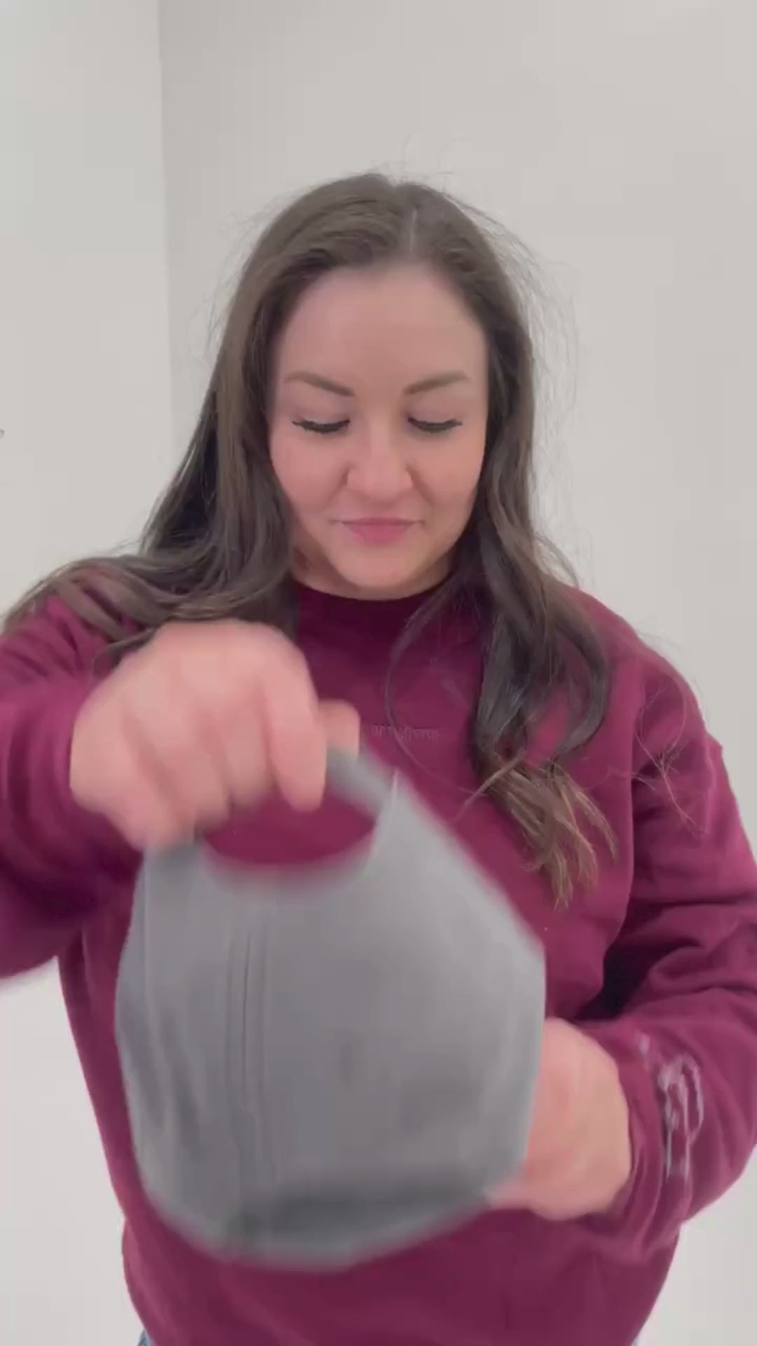 Video of model putting on gray hat with maroon embroidery "Mother" - Little Mama Shirt Shop