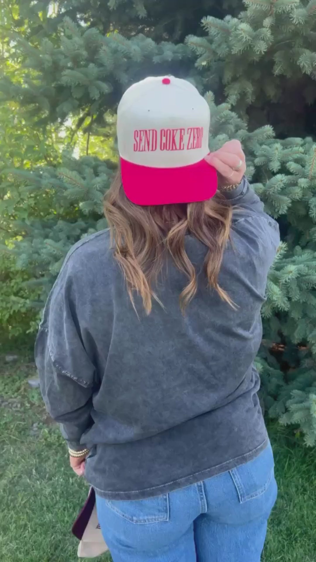 Video of red and cream trucker hat with bold red 'SEND COKE ZERO' text, seen on model - Little Mama Shirt Shop