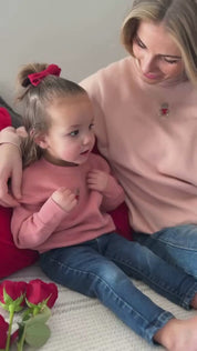 Video of child mauvelous and adult pink sweaters with valentine's teddy Embroidery on front, shown on models  – Little Mama Shirt Shop