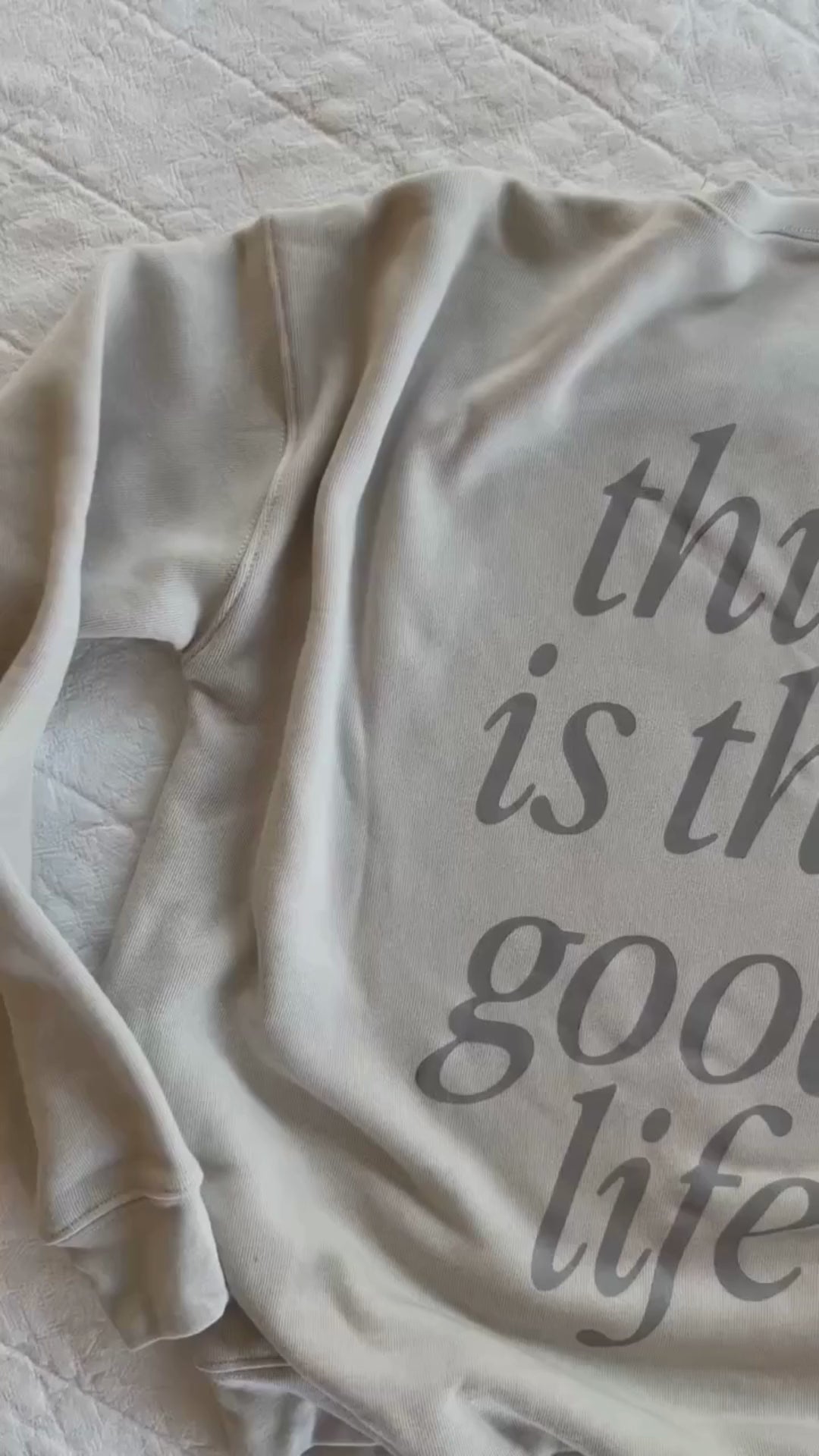 Video of adult fleece in cream with 'this is the good life' printed on the back, seen on flat lay - Little Mama Shirt Shop