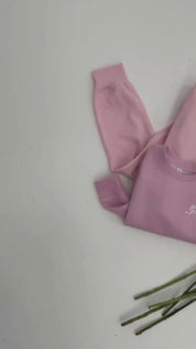 Video of adult and child sweaters in light pink with "girl gang" design on front chest, shown on flat lay - Little Mama Shirt Shop