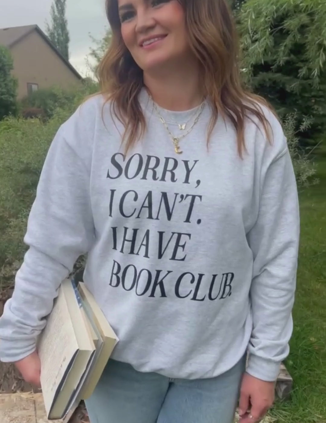 Video of unisex fleece sweatshirt in ash with “Sorry, I Can't. I Have Book Club.” design, on model – Little Mama Shirt Shop