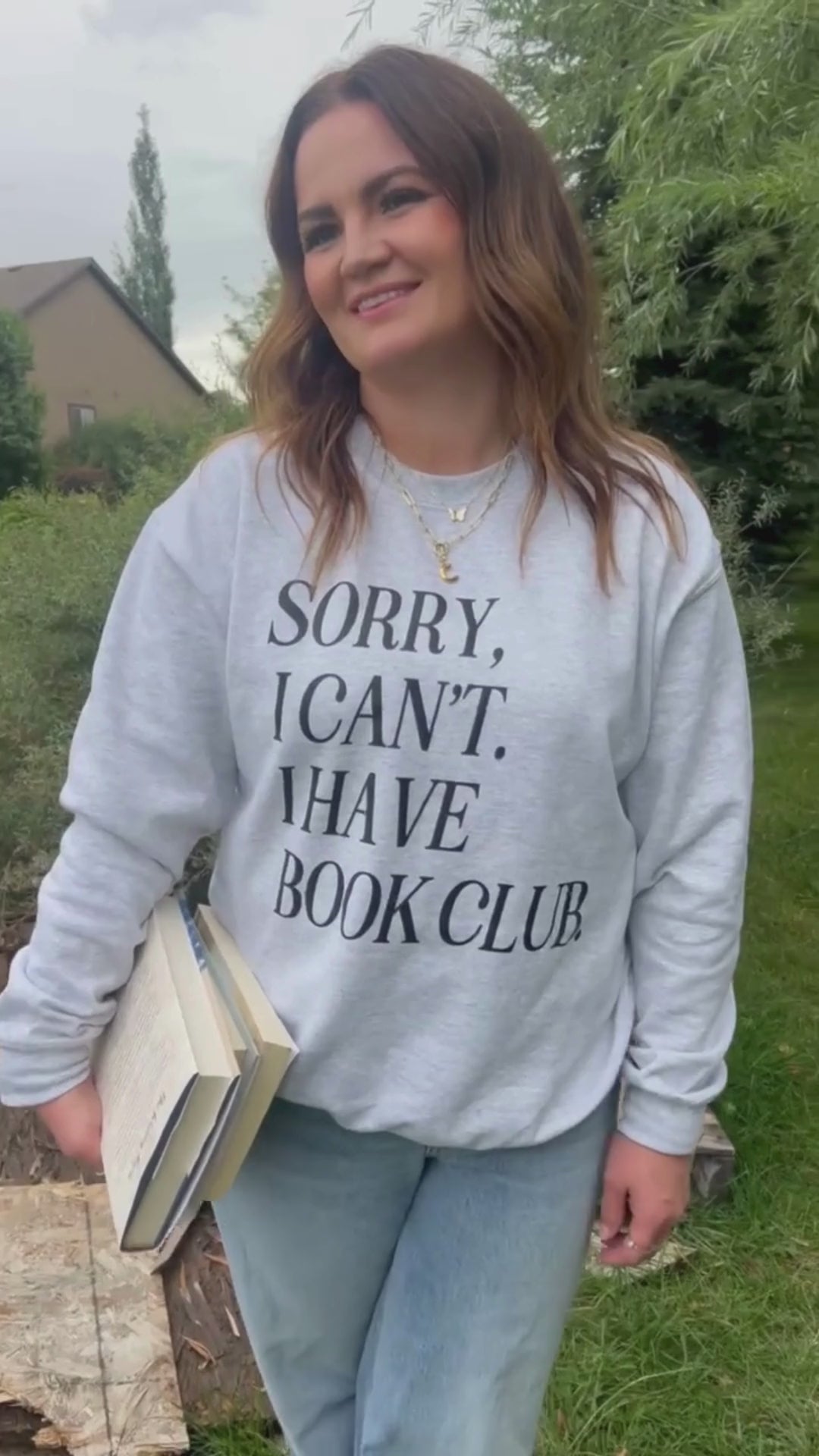 Video of unisex fleece sweatshirt in ash with “Sorry, I Can't. I Have Book Club.” design, on model – Little Mama Shirt Shop