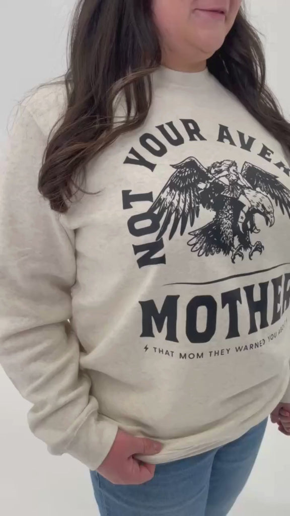 Video of adult and child sweaters in natural with "Not Your Average" design on front, shown on models  – Little Mama Shirt Shop