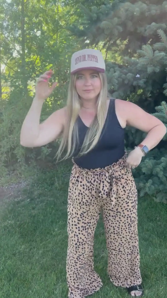 Video of red and cream trucker hat with bold red 'SEND DR. PEPPER' text, seen on model - Little Mama Shirt Shop