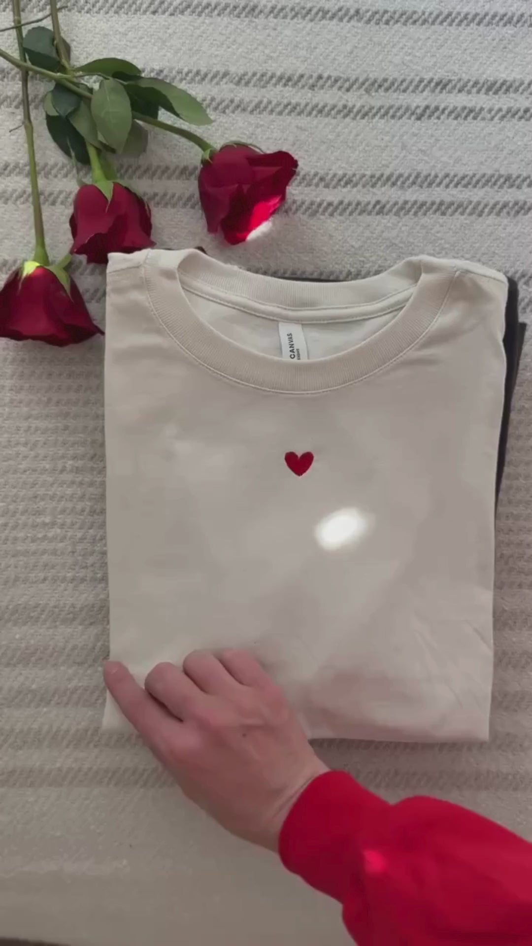 Flip through tee video of Adult tees in maroon, natural, soft pink, vintage red, and dark gray with mini symbol designs on front, shown on flat lay – Little Mama Shirt Shop