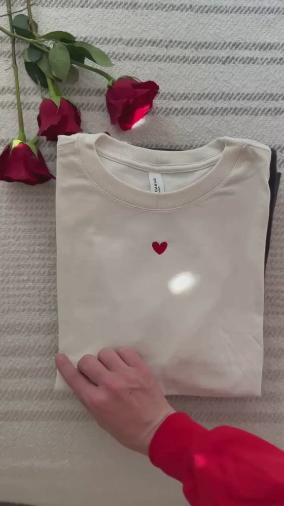 Flip through tee video of Adult tees in maroon, natural, soft pink, vintage red, and dark gray with mini symbol designs on front, shown on flat lay – Little Mama Shirt Shop