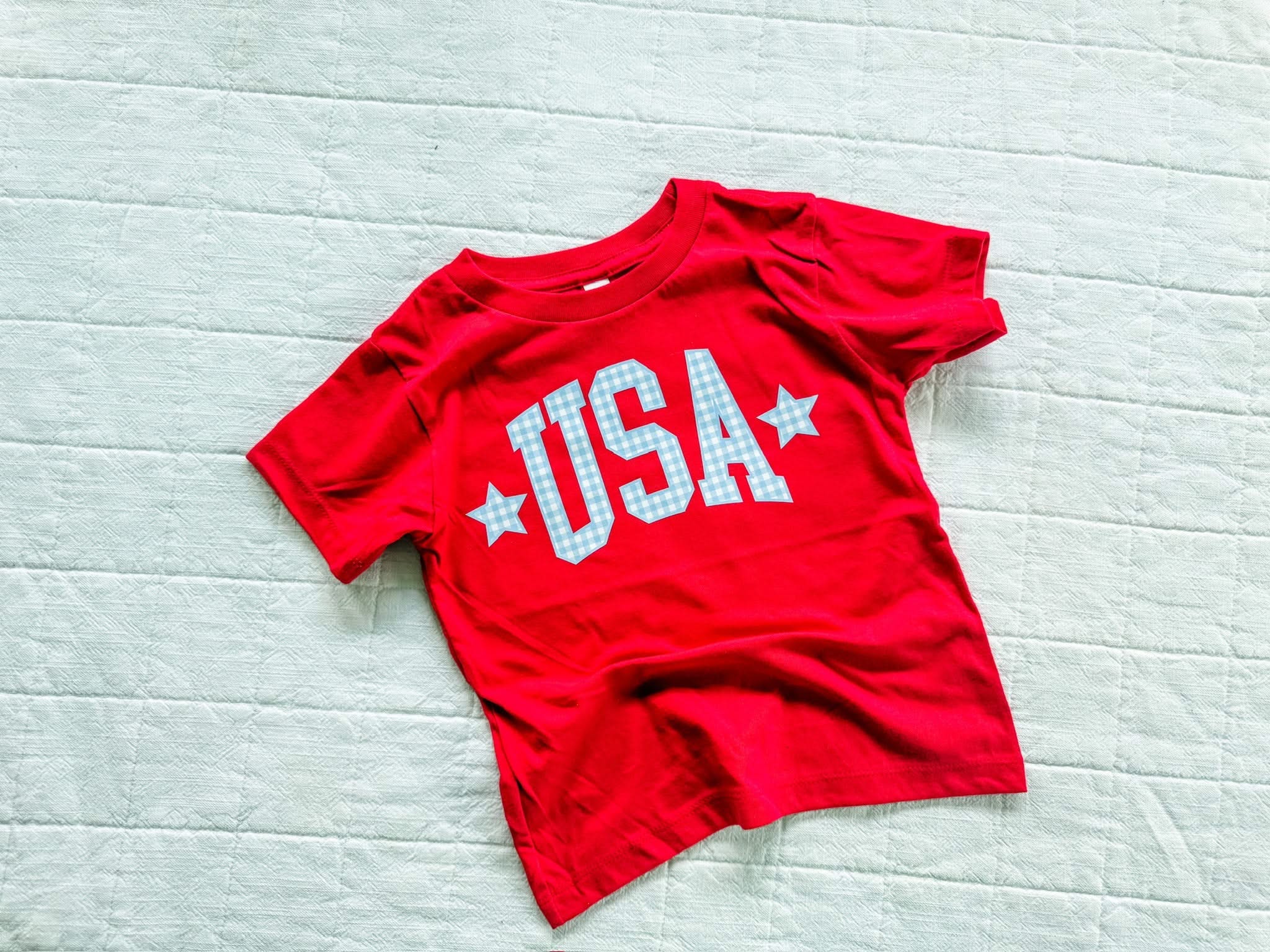 Red USA shirt for kids with gingham lettering, simple patriotic outfit for summer celebrations