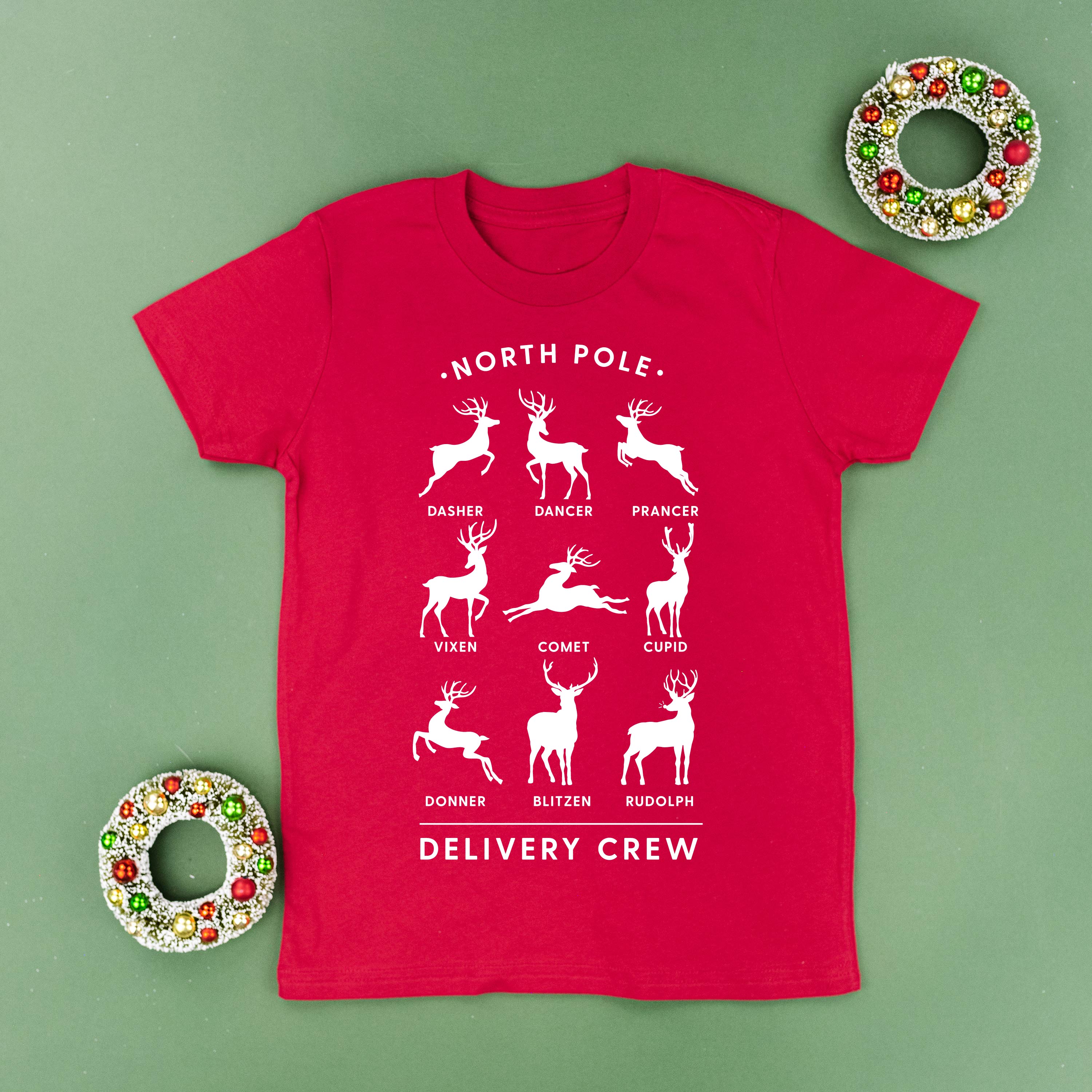 short_sleeve_kids_tees_north_pole_delivery_crew_little_mama_shirt_shop