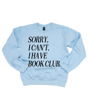 Unisex fleece sweatshirt in light blue with “Sorry, I Can't. I Have Book Club.” design, on flat lay – Little Mama Shirt Shop