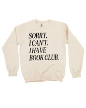 Unisex fleece sweatshirt in sand with “Sorry, I Can't. I Have Book Club.” design, on flat lay – Little Mama Shirt Shop