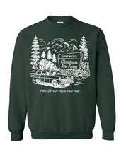 Adult basic fleece in forest with St. Nick's Christmas Tree Farm graphic on the front, shown on flat lay – Little Mama Shirt Shop