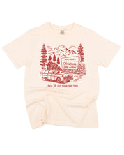 Comfort Colors Tee in ivory with St. Nick's Christmas Tree Farm graphic on the front, shown on flat lay – Little Mama Shirt Shop