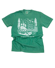 Comfort Colors Tee in light green with St. Nick's Christmas Tree Farm graphic on the front, shown on flay lay – Little Mama Shirt Shop