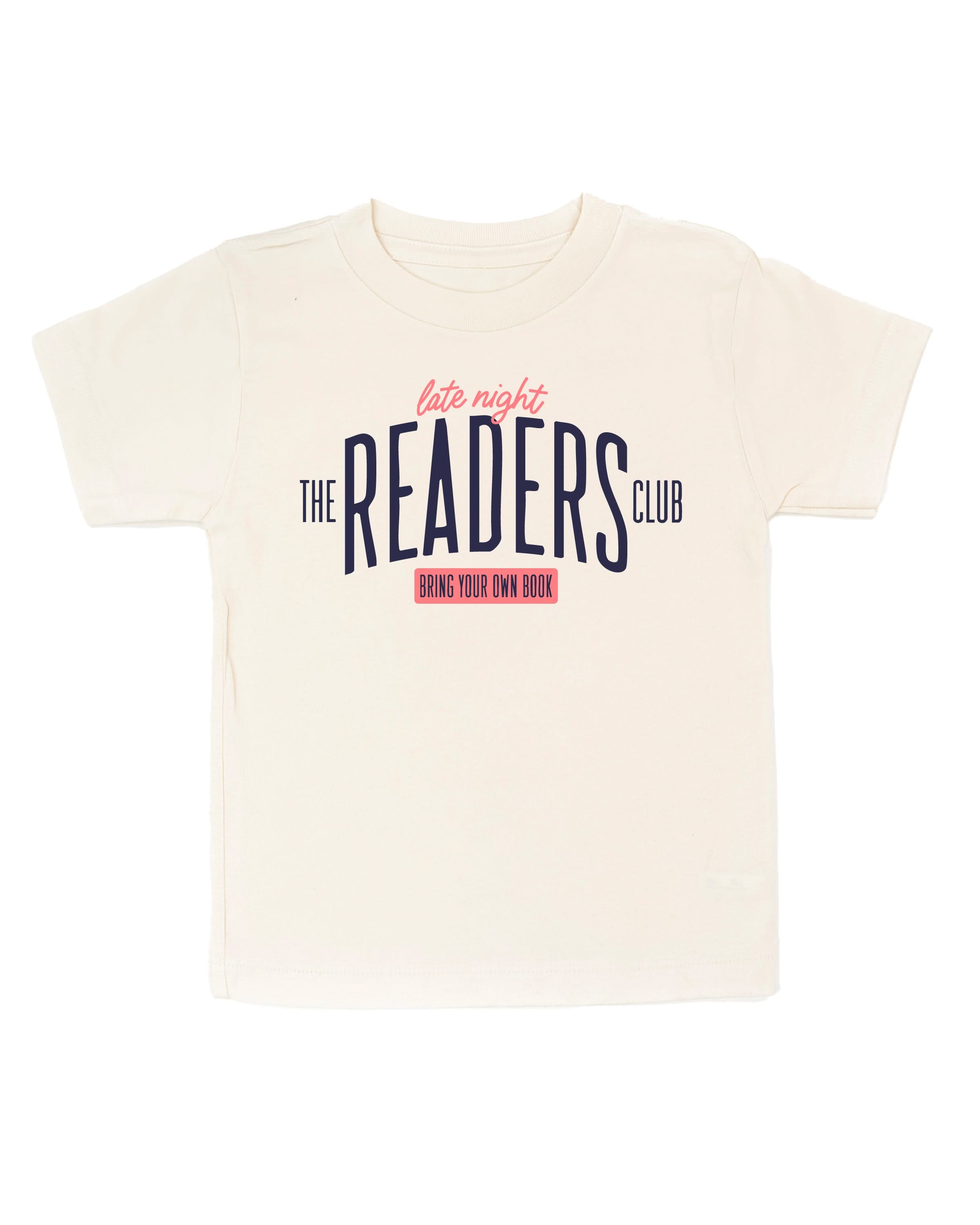 Child’s t-shirt with “Late Night Readers Club BYOB” design in natural, on flat lay – Little Mama Shirt Shop