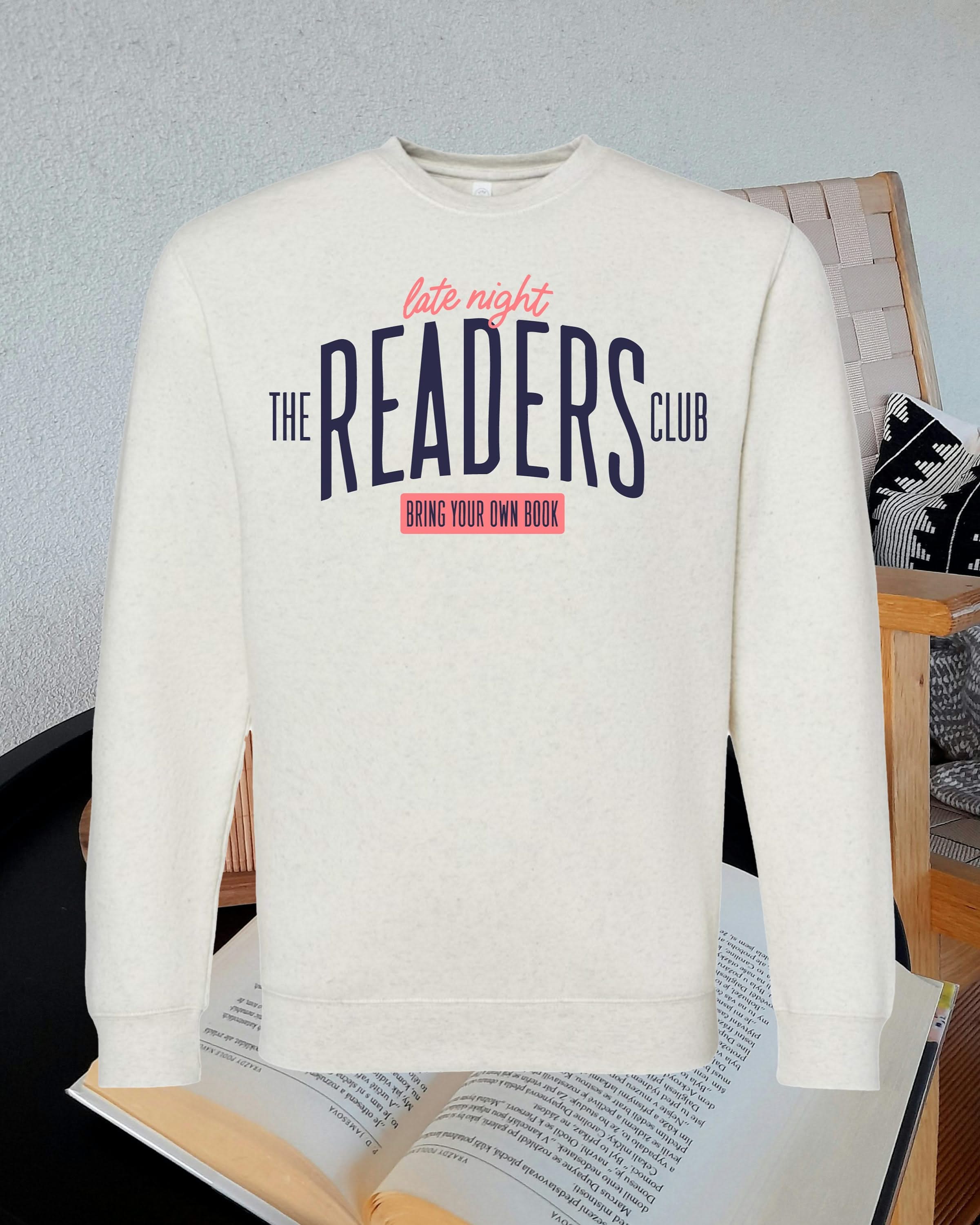 Natural heather unisex fleece sweatshirt with “Late Night Readers Club BYOB” design on flat lay – Little Mama Shirt Shop